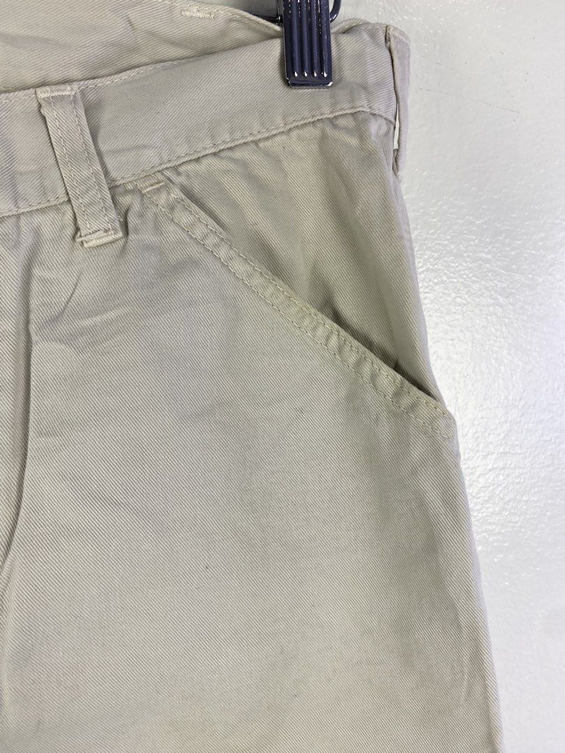 Carhartt Cream Utility Work Pants (Category: Jeans) located in Manila. Submitted by declutterpromax (Listing ID 1466231657, Image 3). Description: - Color: Cream / Off-white - Style: Classic workwear utility pants with straight leg fit - Size: Marked size 32 - Material: Durable canvas-like fabric - Features: Slant front pockets and reinforced stitching along the legs - Condition: Great neutral piece that easily matches any top or jacket.