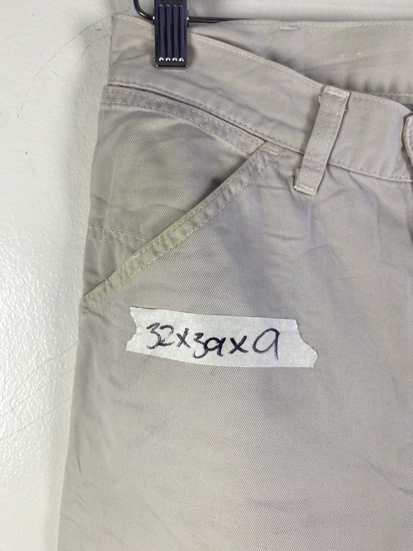 Carhartt Cream Utility Work Pants (Category: Jeans) located in Manila. Submitted by declutterpromax (Listing ID 1466231657, Image 2). Description: - Color: Cream / Off-white - Style: Classic workwear utility pants with straight leg fit - Size: Marked size 32 - Material: Durable canvas-like fabric - Features: Slant front pockets and reinforced stitching along the legs - Condition: Great neutral piece that easily matches any top or jacket.