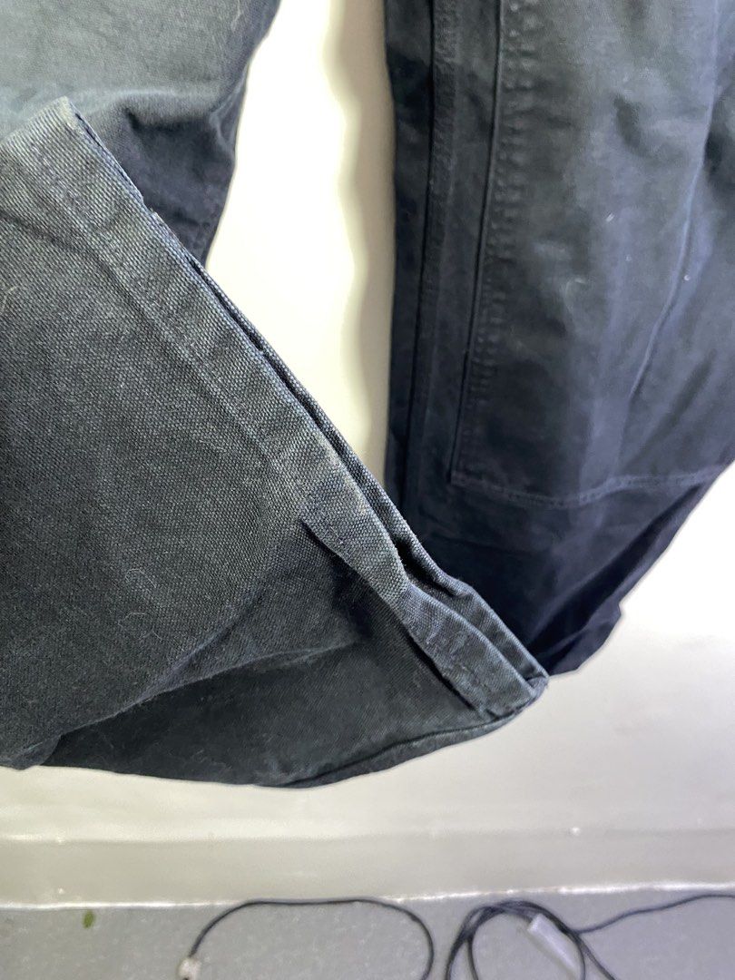 Carousell Carhartt Double Knee Work Pants Black (Category: Jeans) located in Manila. Submitted by declutterpromax (Listing ID 1466231653, Image 3). Description: - Brand/Model: Carhartt Double Knee Work Pants - Color: Classic Black - Material: Heavy-duty duck canvas - Fit: Wide leg, utility style - Features: Double front panels for extra durability, zip fly with brass button closure - Condition: Normal signs of wear on hems and fabric - Perfect fo