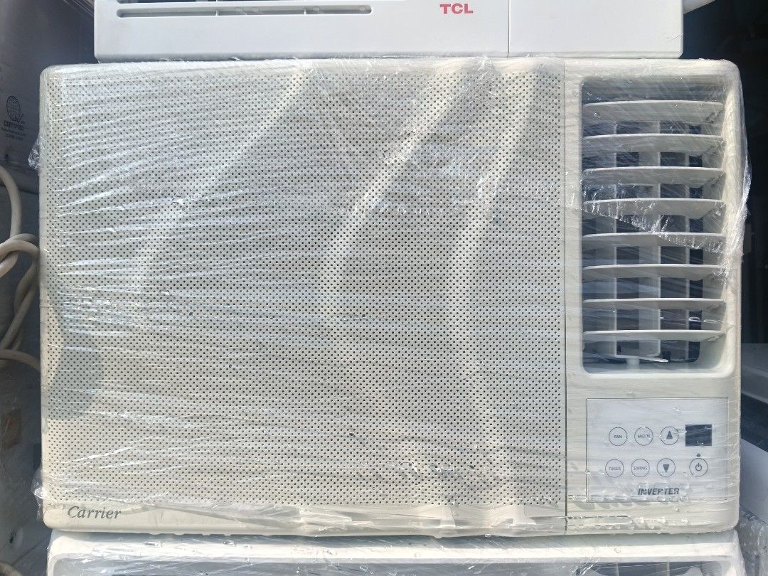 Carrier Window Type Inverter Air Conditioner (Category: Air Conditioning and Heating) located in Manila. Submitted by jamaya09 (Listing ID 1466248578, Image 1). Description: - Brand: Carrier Window Type Air Conditioner - Technology: Inverter Model for energy savings - Color/Design: Standard white finish with perforated front grille - Controls: Digital control buttons located on the bottom right - Condition: Brand new, wrapped in protective plasti