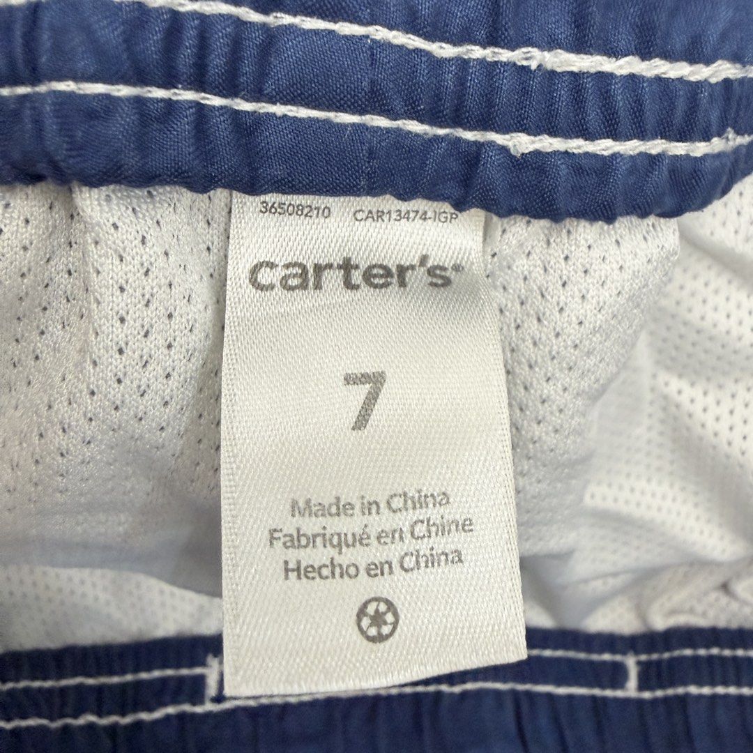 Carter's Shark Swim Trunks Size 7 (Category: Babies & Kids Fashion) located in Pasig City. Submitted by boymom20 (Listing ID 1466199672, Image 3). Description: - Brand: Carter's - Item: Boy's Swim Trunks - Size: 7 (Tag attached) - Design: Fun all-over shark print in blue - Comfort: Elastic waistband with adjustable drawstring - Interior: Built-in mesh lining - Condition: Great for pool, beach, or vacation LAST PRICE POSTED + 75 SHIPPING FEE VIA J