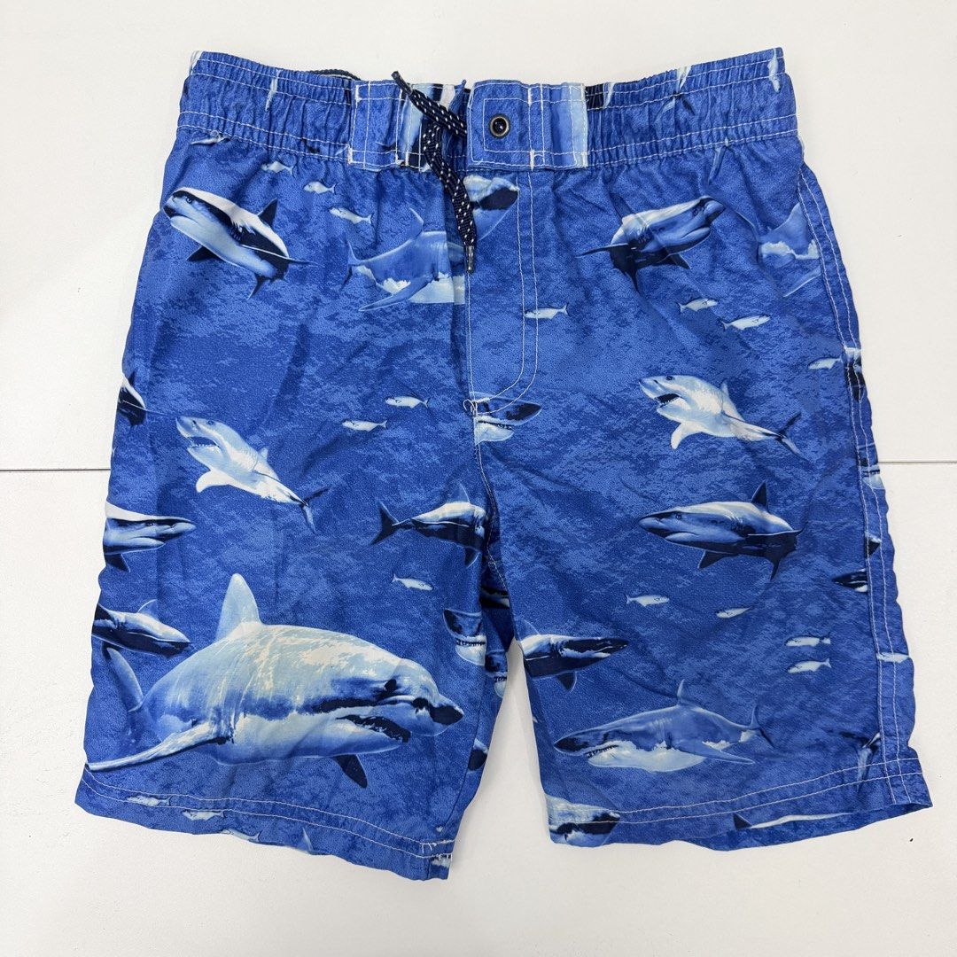 Carter's Shark Swim Trunks Size 7 (Category: Babies & Kids Fashion) located in Pasig City. Submitted by boymom20 (Listing ID 1466199672, Image 1). Description: - Brand: Carter's - Item: Boy's Swim Trunks - Size: 7 (Tag attached) - Design: Fun all-over shark print in blue - Comfort: Elastic waistband with adjustable drawstring - Interior: Built-in mesh lining - Condition: Great for pool, beach, or vacation LAST PRICE POSTED + 75 SHIPPING FEE VIA J
