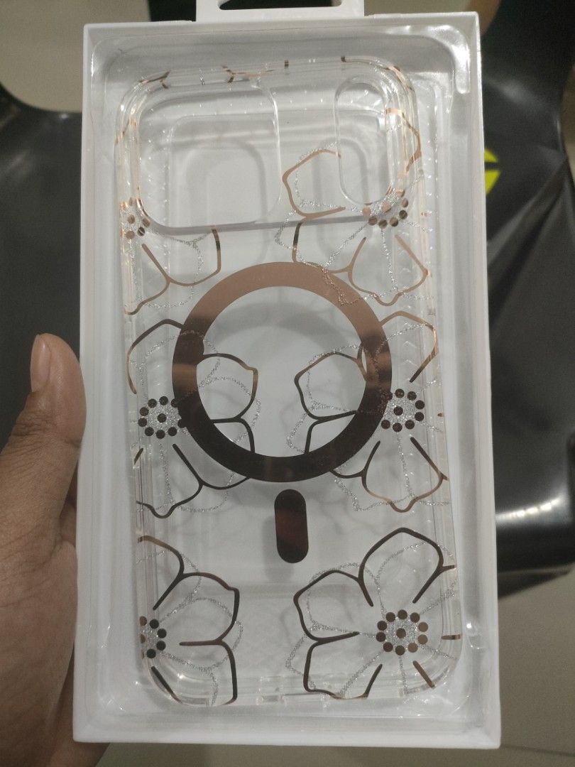 Case iPhone 17 pro max mall (Category: Cases & Sleeves) located in Quezon City. Submitted by Cassidy (Listing ID 1466179095, Image 1). Description: - Model: iPhone 17 Pro Max - Design: Clear case with elegant rose gold floral and glitter accents - Feature: Built-in MagSafe magnetic ring - Condition: Brand new in original packaging - Perfect for daily protection with a stylish touch - Original price 1000.