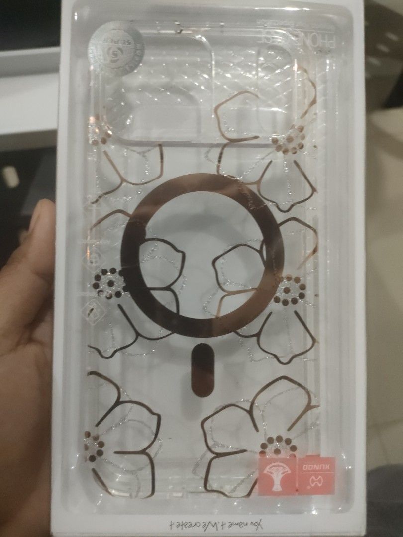 Case iPhone 17 pro max mall (Category: Cases & Sleeves) located in Quezon City. Submitted by Cassidy (Listing ID 1466179095, Image 2). Description: - Model: iPhone 17 Pro Max - Design: Clear case with elegant rose gold floral and glitter accents - Feature: Built-in MagSafe magnetic ring - Condition: Brand new in original packaging - Perfect for daily protection with a stylish touch - Original price 1000.