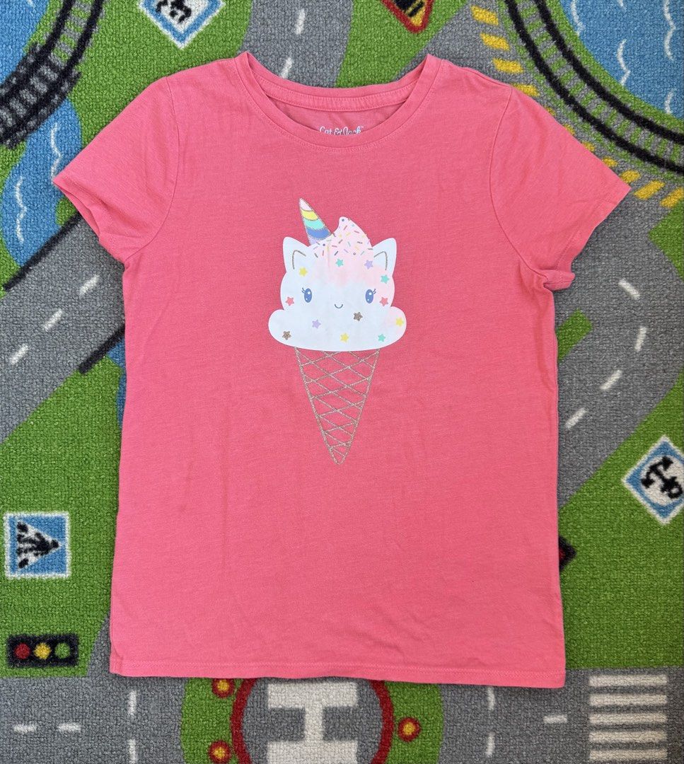 Cat & Jack Graphic T-Shirt (Category: Babies & Kids Fashion) located in Rizal. Submitted by preloovved (Listing ID 1466264356, Image 1). Description: Bright pink Cat & Jack tee featuring a cute unicorn ice cream graphic. Made of soft, comfortable cotton with short sleeves and a classic crew neck. Perfect for everyday wear! Preloved, 7-8yo Meet-up only in GB1 San Mateo, Rizal Shipping fee c/o buyer. Tres Marias or J&T express Payment to be sent to