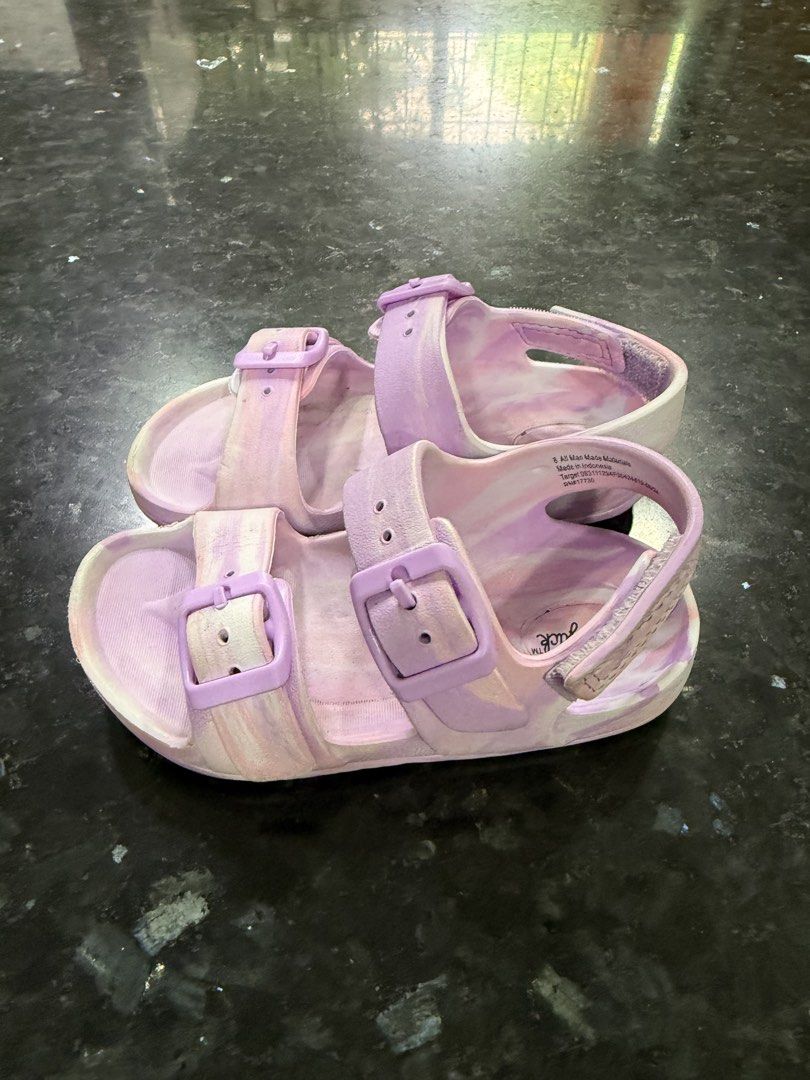 Cat & Jack Purple Marble Sandals Size 8 (Category: Babies & Kids Fashion) located in Calamba. Submitted by sofiesmerch (Listing ID 1466208310, Image 2). Description: - Brand: Cat & Jack - Size: 8 Toddler/Kids - Color: Purple marble wash - Design: Double buckle top straps with secure hook-and-loop heel strap - Comfort & Safety: Textured footbed and honeycomb grip soles - Condition: Shows some wear on the bottom soles and tread from normal use.