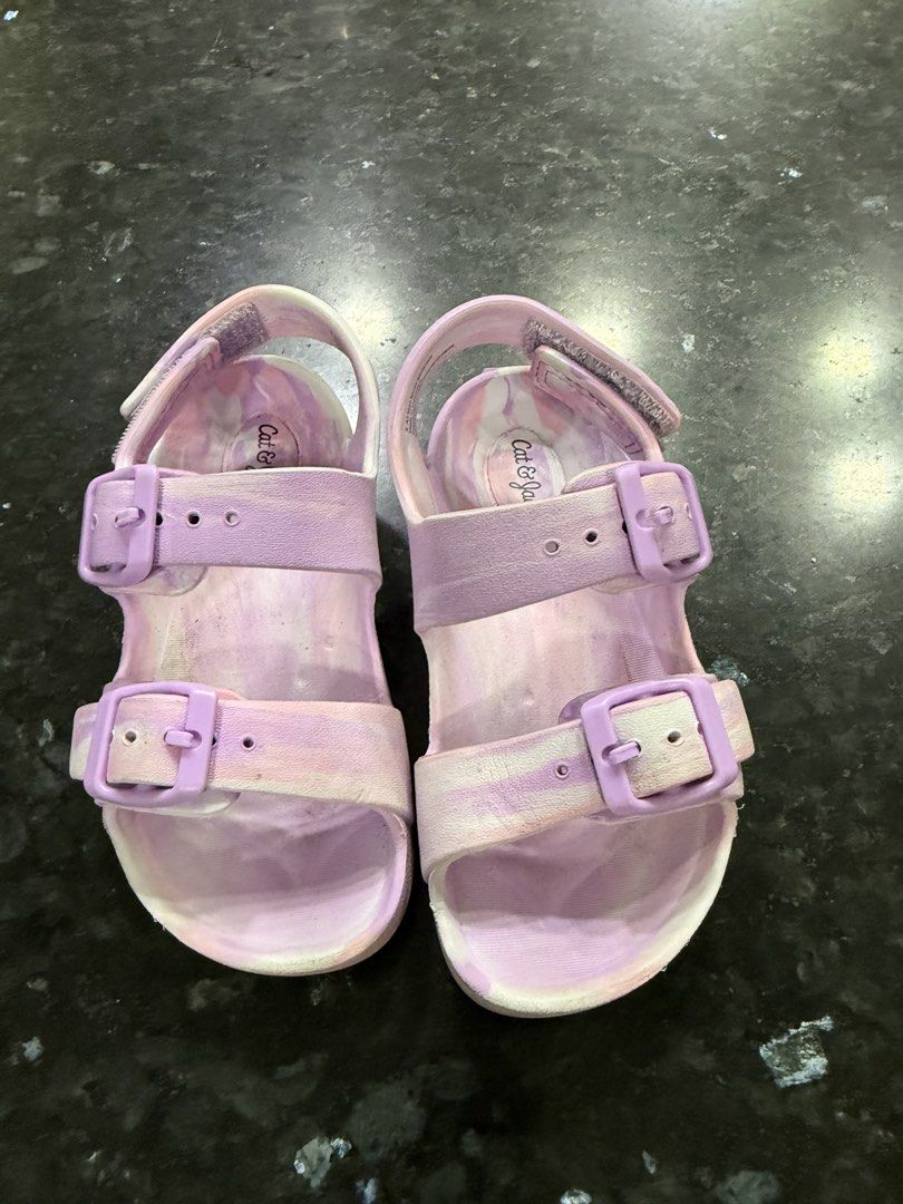 Cat & Jack Purple Marble Sandals Size 8 (Category: Babies & Kids Fashion) located in Calamba. Submitted by sofiesmerch (Listing ID 1466208310, Image 1). Description: - Brand: Cat & Jack - Size: 8 Toddler/Kids - Color: Purple marble wash - Design: Double buckle top straps with secure hook-and-loop heel strap - Comfort & Safety: Textured footbed and honeycomb grip soles - Condition: Shows some wear on the bottom soles and tread from normal use.
