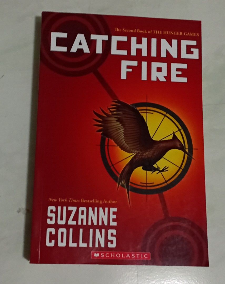 Catching Fire and Mockingjay The Hunger Games (Category: Storybooks) located in Manila. Submitted by luckyfox-3a3e (Listing ID 1466311414, Image 3). Description: - Includes 2 books: Catching Fire (Book 2) and Mockingjay (Book 3) - Author: Suzanne Collins - Publisher: Scholastic (Asia edition) - Genre: Dystopian fiction / Young Adult - Format: Paperback set (Red and Blue covers).