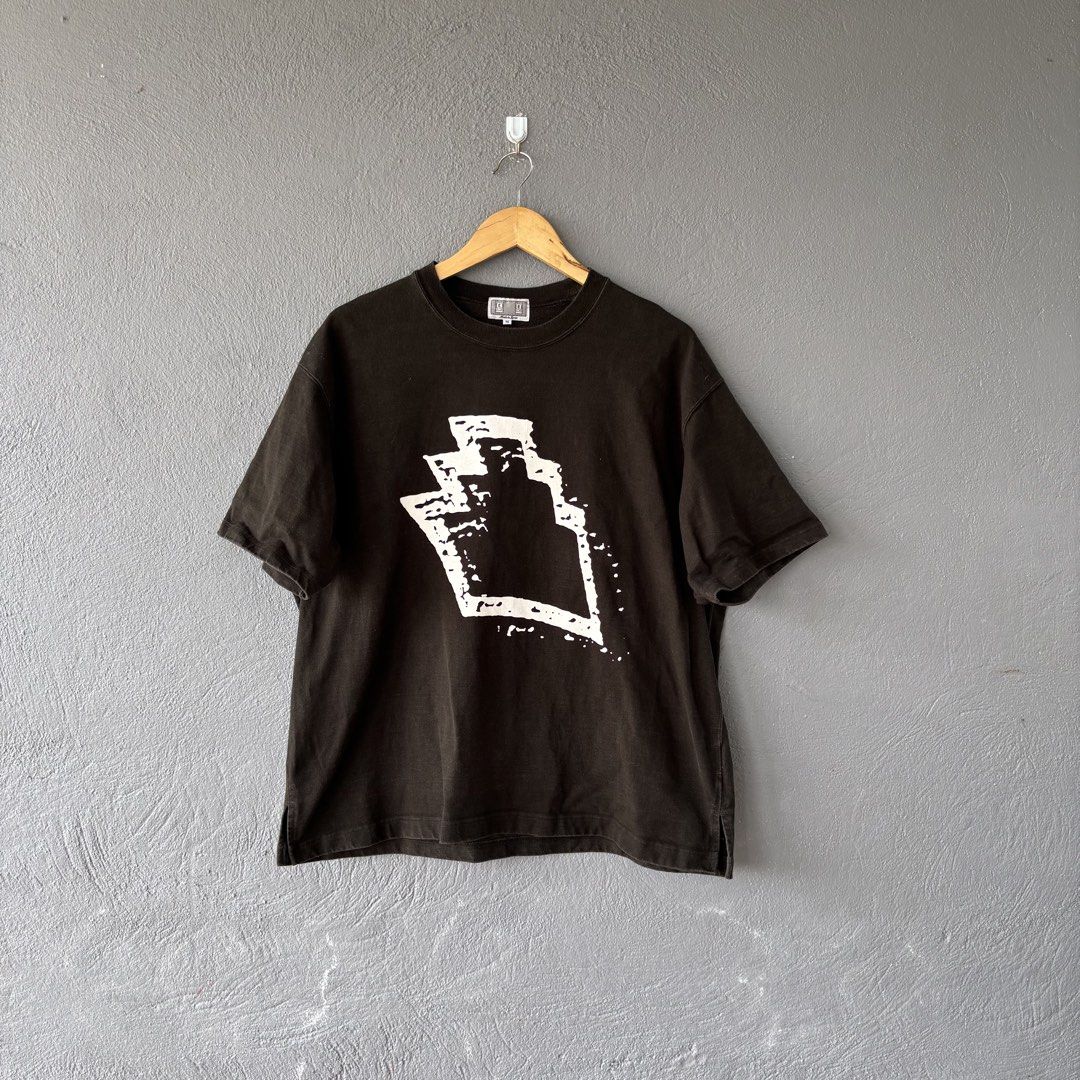Cav empt tee (Category: Tshirts & Polo Shirts ) located in San Fernando. Submitted by diff.thr1ft (Listing ID 1466156452, Image 1). Description: - Brand: Cav Empt - Size: Medium (M) - Color: Dark Brown/Black - Material: 100% Cotton (Made in Japan) - Design: Bold white graphic on front, Cav Empt text branding on upper back - Condition: Excellent pre-owned quality.