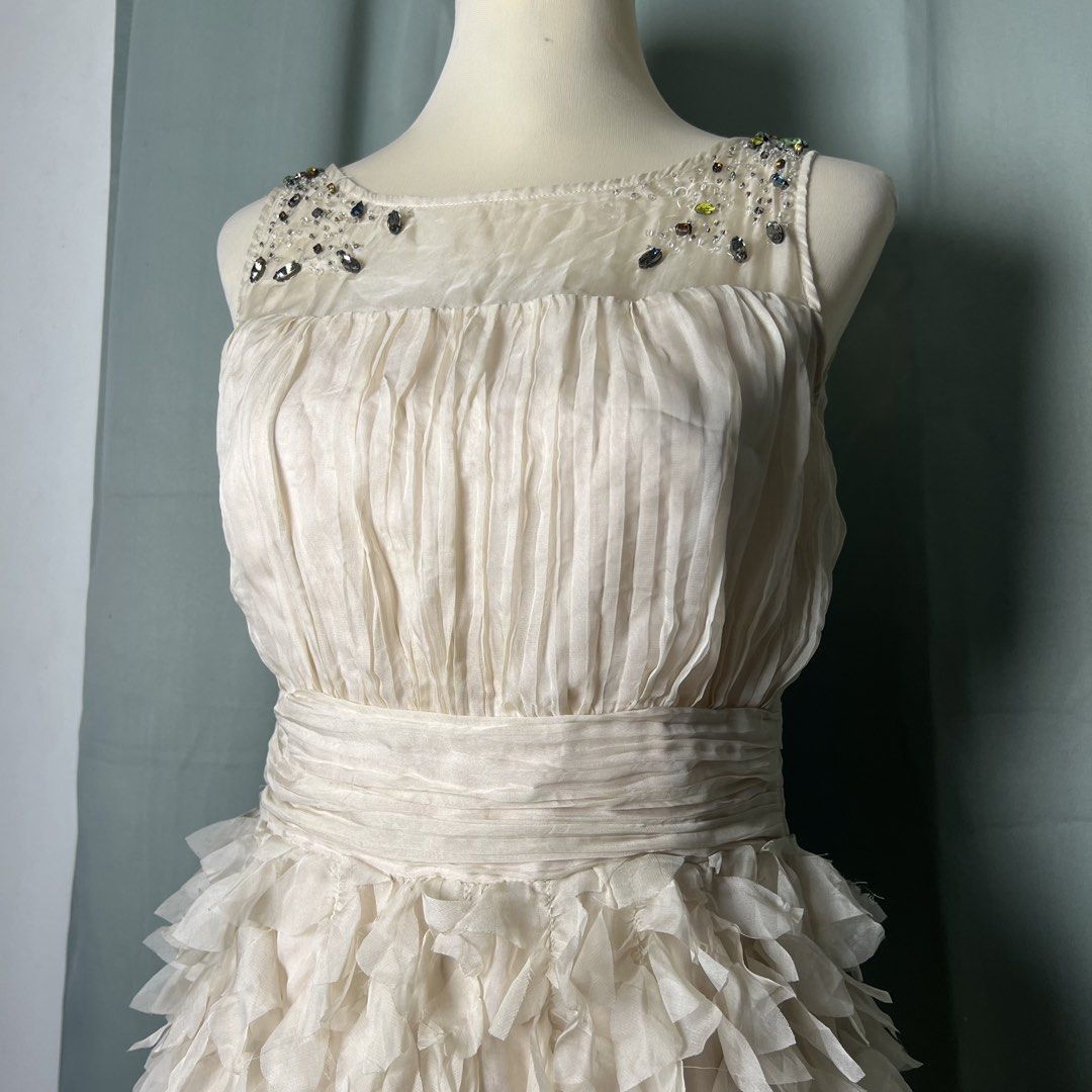 cciguni silk party dress (Category: Dresses) located in Malabon City. Submitted by minidressmonster (Listing ID 1466233605, Image 2). Description: cciguni beige 100% silk ruffled party formal birthday dress very gossip girl haha side zip and has inner lining needs wash, a little dusty due to storage best fit small to medium dimensions bust: 32 in waist: 28 in length: 29 in.