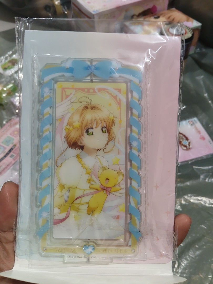 CCS Acrylic Figurine Stand (Category: Other Merchandise) located in San Marcelino. Submitted by cmplushies (Listing ID 1466319034, Image 1). Description: Front - Sakura Back - The Flight.