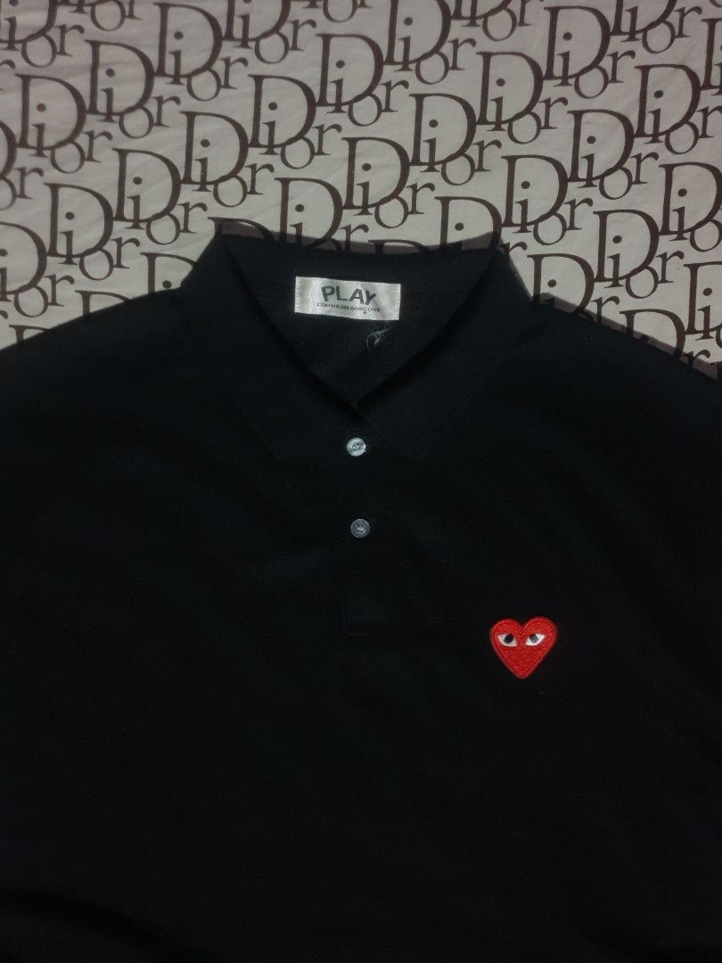 CDG Play black poloshirt (Category: Tshirts & Polo Shirts ) located in San Fernando. Submitted by retro.district. (Listing ID 1466271840, Image 2). Description: - CDG Play black poloshirt - Size: XL (23x29) - Condition: Excellent - Issue missing washtag - Color Rate: 9.5/10.