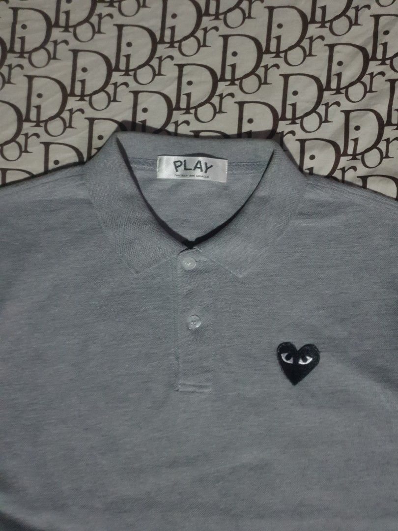 CDG Play gray poloshirt (Category: Tshirts & Polo Shirts ) located in San Fernando. Submitted by retro.district. (Listing ID 1466271139, Image 2). Description: - CDG Play Gray poloshirt - Size: Medium (20x26) - Condition: Excellent - Issue cut washtag - Color Rate: 9.5/10.