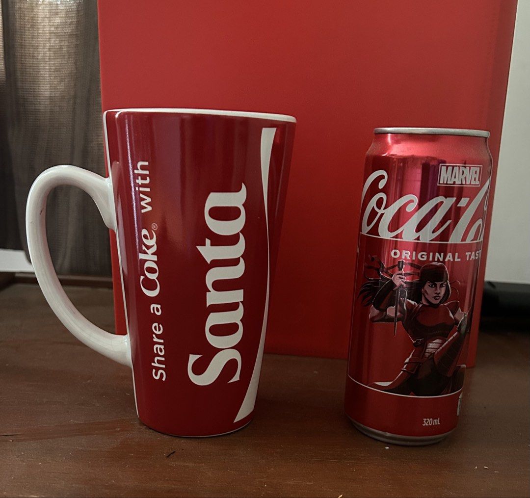 Ceramic Coca Cola Mug (Category: Water Bottles & Tumblers) located in Binan City. Submitted by impulsebuyer12 (Listing ID 1466234165, Image 2). Description: The can beside the mug is for height comparison only (not included). Mug is new but washed once due to dust while on display. Bought in the US.