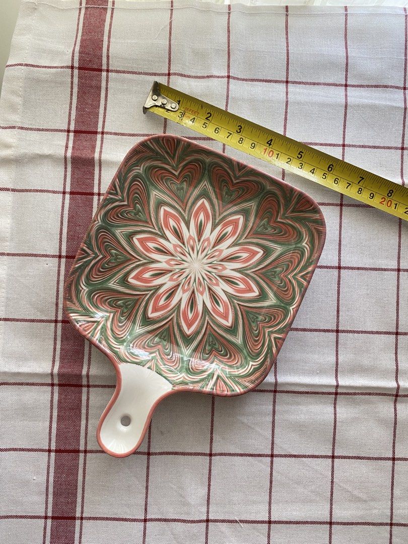 Ceramic Square Serving Dish with Handle Pink Green Floral (Category: Dinnerware & Cutlery) located in Mandaluyong City. Submitted by lovegood711 (Listing ID 1466160078, Image 3). Description: Square, ceramic serving dish with pretty pink and green floral marbling pattern. Handy handle with hole for hanging or easy grip. Measures around 8 inches across. Deep edges to keep food contained. Great for serving snacks, side dishes, your morning sandwich