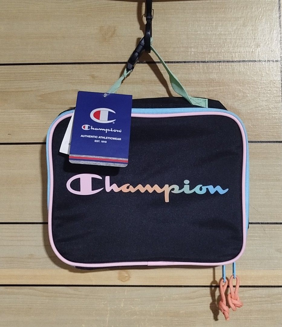 Champion Lunch Bag Black Multi Color (Category: Luxury Bags & Wallets) located in Taguig. Submitted by giango1313 (Listing ID 1466160236, Image 1). Description: - Brand new with original store tags attached - Authentic Black Champion insulated lunch bag - Eye-catching pastel rainbow logo lettering on the front - Light green top handle equipped with a convenient buckle clasp - Stylish blue zipper trim with peach-colored cord pulls - Insulated silv