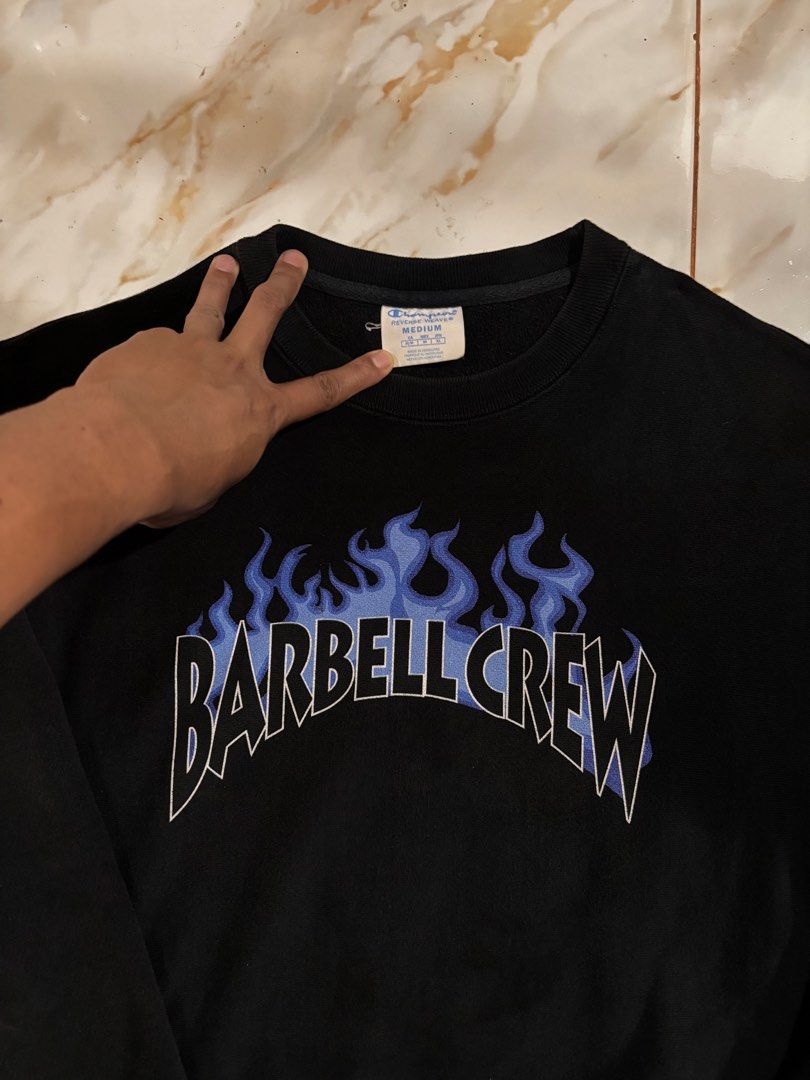 Champion Reverse Weave Barbell Crew Flame Sweatshirt Black Medium (Category: Coats, Jackets and Outerwear) located in Dumaguete. Submitted by revillahar03975 (Listing ID 1466328968, Image 1). Description: - Brand/Model: Authentic Champion Reverse Weave Sweatshirt - Size: Medium - Color: Black - Design: Blue flame graphic with 'Barbell Crew' lettering on front, classic Champion logo patch on left cuff - Material: Thick, warm cotton blend - Details
