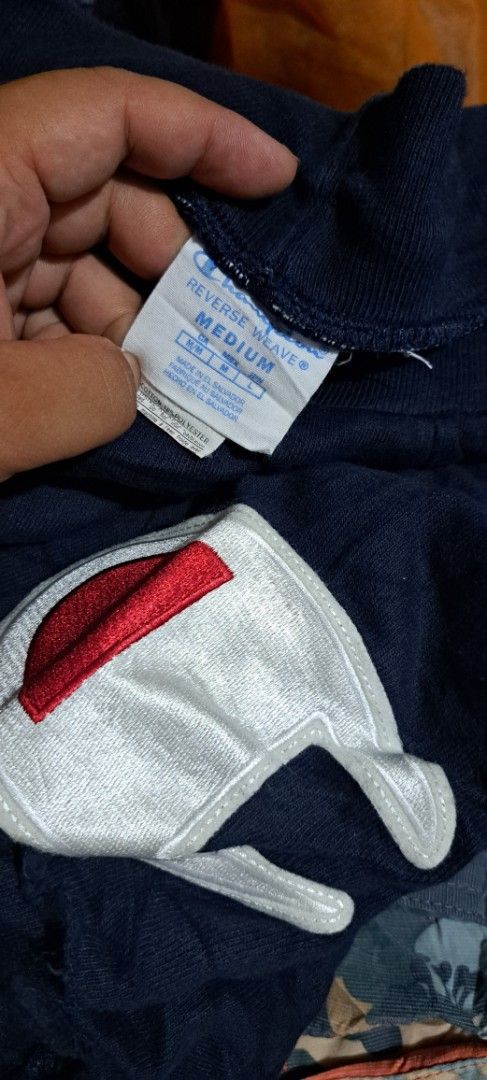 Champion Reverse Weave Navy Shorts Size M (Category: Shorts) located in San Fernando, Camarines Sur. Submitted by ladderaya (Listing ID 1466229772, Image 2). Description: - Brand: Champion Reverse Weave - Size: Medium (tag attached) - Color: Navy - Material: Soft cotton blend - Origin: Made in El Salvador - Features: Big embroidered logo patch on lower left leg, drawstring waistband, and side pockets - Condition: Brand new with tags, great casual