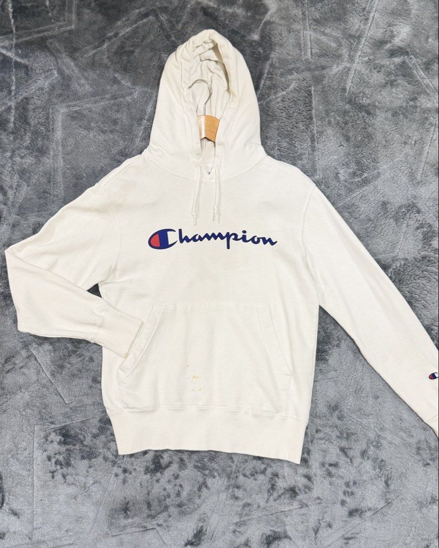 Champion Script Logo White Hoodie Size Small (Category: Hoodies) located in Manila. Submitted by yeti_it (Listing ID 1466159048, Image 1). Description: - Brand: Champion - Item: Classic Script Logo Hoodie - Color: White - Size: Small - Features: Adjustable drawstring hood, front kangaroo pocket, soft fleece interior, ribbed cuffs and hem - Condition: Pre-loved, with noticeable light brownish stains near the bottom pocket area (please check photos