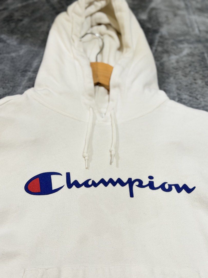 Champion Script Logo White Hoodie Size Small (Category: Hoodies) located in Manila. Submitted by yeti_it (Listing ID 1466159048, Image 3). Description: - Brand: Champion - Item: Classic Script Logo Hoodie - Color: White - Size: Small - Features: Adjustable drawstring hood, front kangaroo pocket, soft fleece interior, ribbed cuffs and hem - Condition: Pre-loved, with noticeable light brownish stains near the bottom pocket area (please check photos