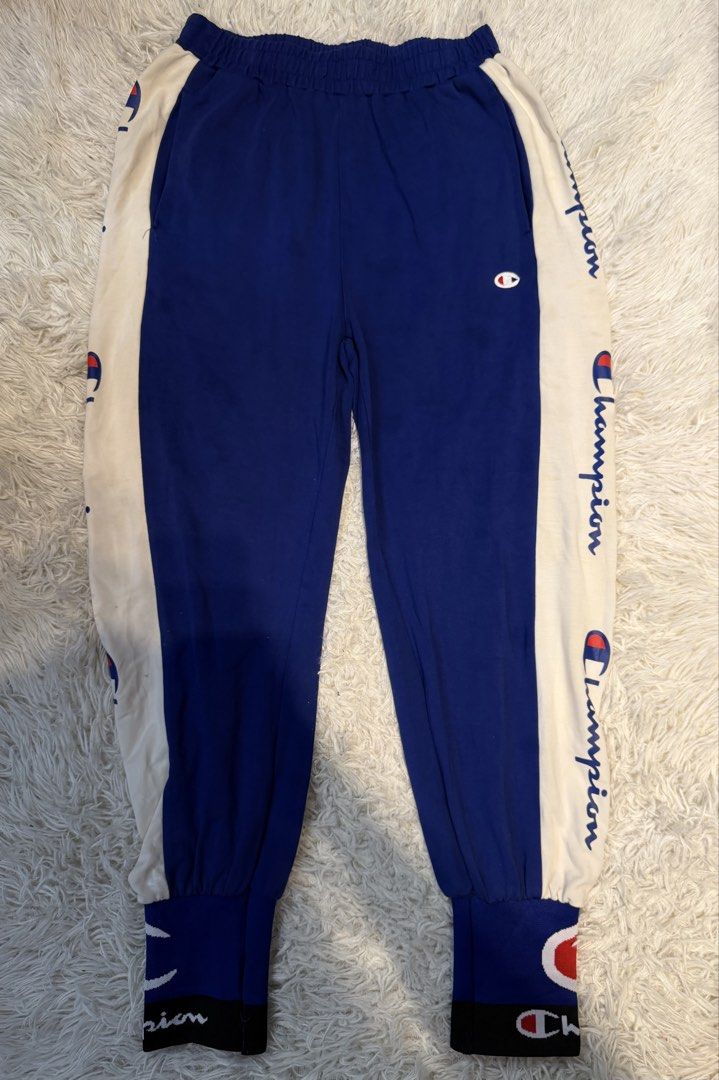 Champion Track Pants (Category: Joggers) located in San Pedro. Submitted by iamharoldguerrero (Listing ID 1466169420, Image 1). Description: Champion Track Pants with Side Logo Tape & Cuffed Ankles Price: ₱100 only! Details: - Brandnew (Copy Only) - Color: Blue Body with white side panels and script logo branding - Dimensions: H; 39, W; 22 (inches) - Unused & Never Been Worned - no issues Location: San Pedro, Laguna - Free Delivery within San Ped