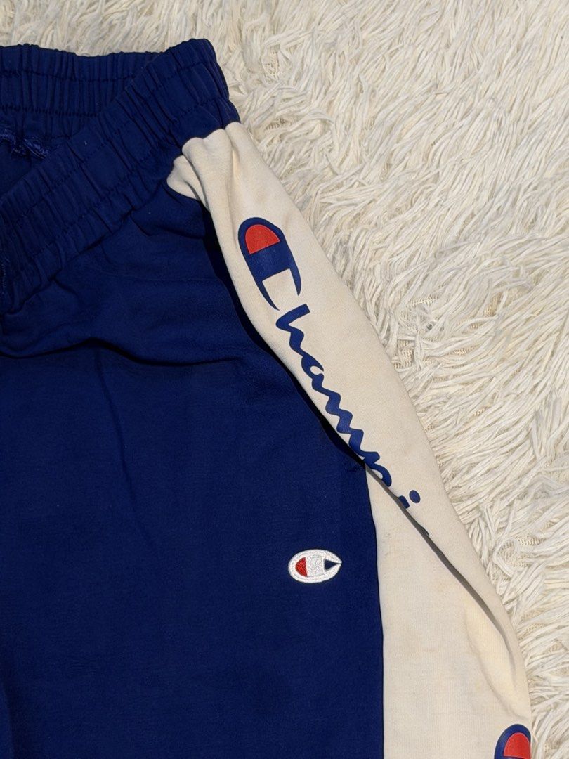 Champion Track Pants (Category: Joggers) located in San Pedro. Submitted by iamharoldguerrero (Listing ID 1466169420, Image 2). Description: Champion Track Pants with Side Logo Tape & Cuffed Ankles Price: ₱100 only! Details: - Brandnew (Copy Only) - Color: Blue Body with white side panels and script logo branding - Dimensions: H; 39, W; 22 (inches) - Unused & Never Been Worned - no issues Location: San Pedro, Laguna - Free Delivery within San Ped