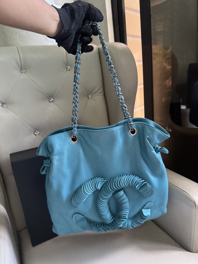 Chanel Leather Disc Bon Bon Turquoise (Category: Luxury Bags & Wallets) located in Manila. Submitted by luxeluggagestation (Listing ID 1466185558, Image 2). Description: Very nice 💯% Guaranteed Original Chanel Disc Bon Leather Turquoise color Length 45 cm Width 1 cm Height 40 cm Handle Drop 23 cm Comes with Dust bag, Box and Ribbon .