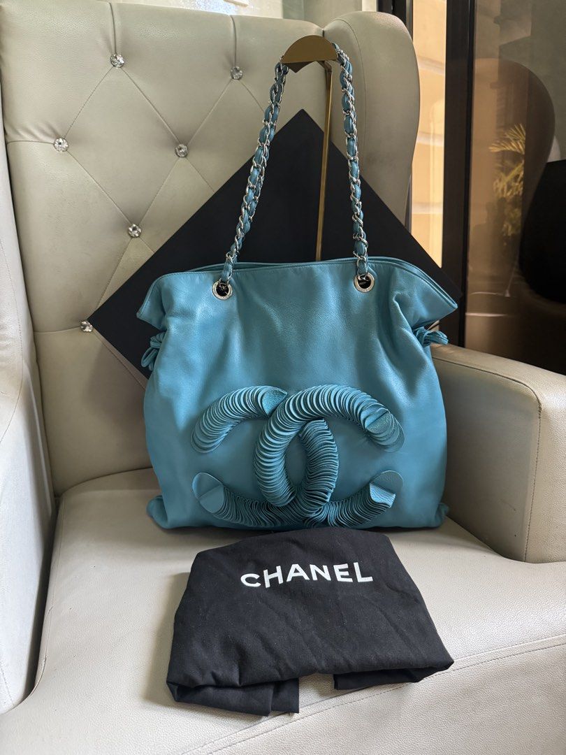 Chanel Leather Disc Bon Bon Turquoise (Category: Luxury Bags & Wallets) located in Manila. Submitted by luxeluggagestation (Listing ID 1466185558, Image 1). Description: Very nice 💯% Guaranteed Original Chanel Disc Bon Leather Turquoise color Length 45 cm Width 1 cm Height 40 cm Handle Drop 23 cm Comes with Dust bag, Box and Ribbon .