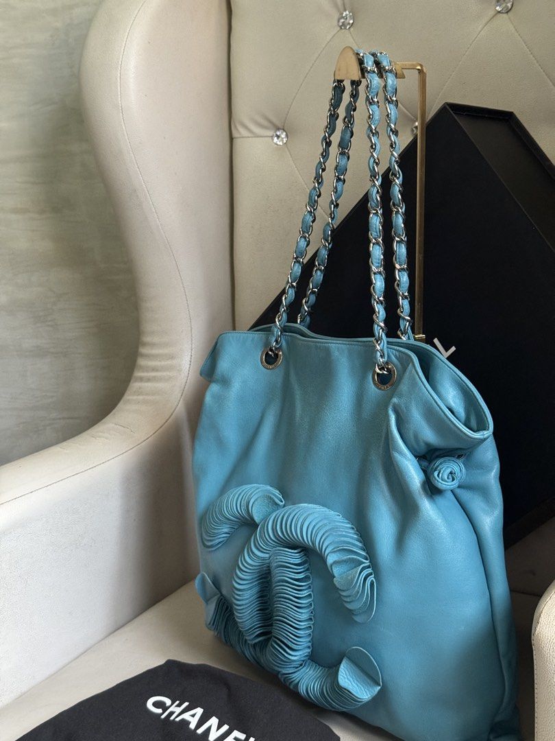 Chanel Leather Disc Bon Bon Turquoise (Category: Luxury Bags & Wallets) located in Manila. Submitted by luxeluggagestation (Listing ID 1466185558, Image 3). Description: Very nice 💯% Guaranteed Original Chanel Disc Bon Leather Turquoise color Length 45 cm Width 1 cm Height 40 cm Handle Drop 23 cm Comes with Dust bag, Box and Ribbon .