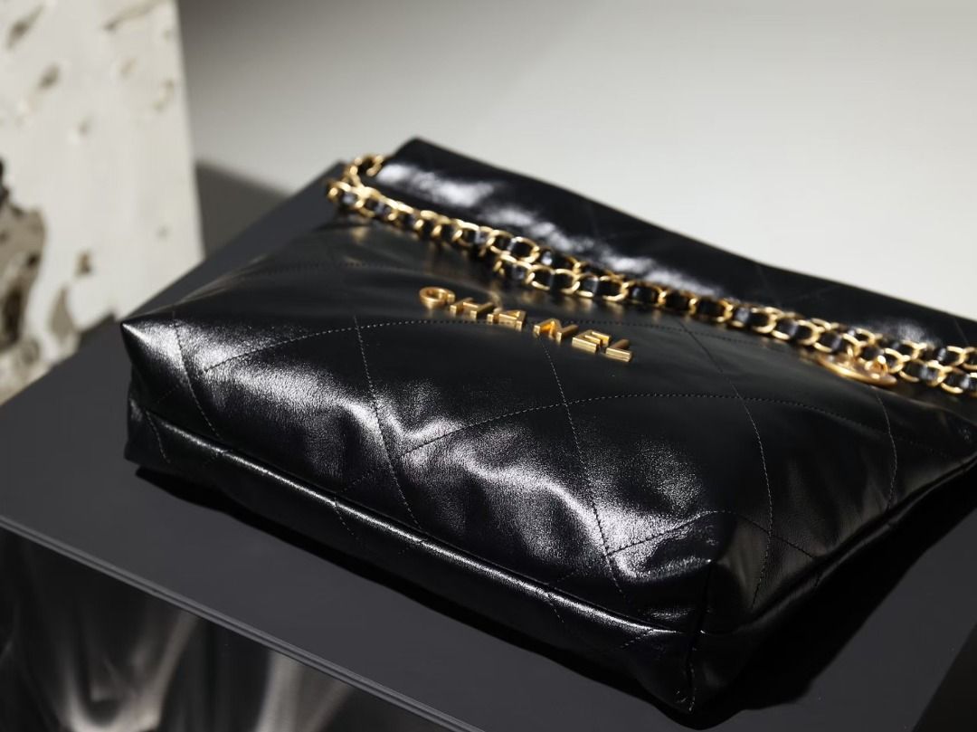 Chanel Quilted Black Leather Chain Shoulder Bag (Category: Luxury Bags & Wallets) located in San Juan City. Submitted by leberganub78210 (Listing ID 1466239301, Image 2). Description: - Authentic Chanel shoulder bag in classic black quilted leather - Luxurious gold-tone hardware featuring iconic interlocking CC branding - Double leather-woven chain straps with a stylish dangling Chanel Paris coin charm - Classic diamond quilting pattern throughou