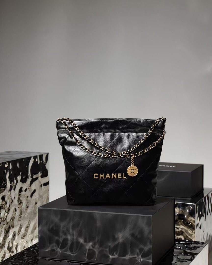 Chanel Quilted Black Leather Chain Shoulder Bag (Category: Luxury Bags & Wallets) located in San Juan City. Submitted by leberganub78210 (Listing ID 1466239301, Image 1). Description: - Authentic Chanel shoulder bag in classic black quilted leather - Luxurious gold-tone hardware featuring iconic interlocking CC branding - Double leather-woven chain straps with a stylish dangling Chanel Paris coin charm - Classic diamond quilting pattern throughou
