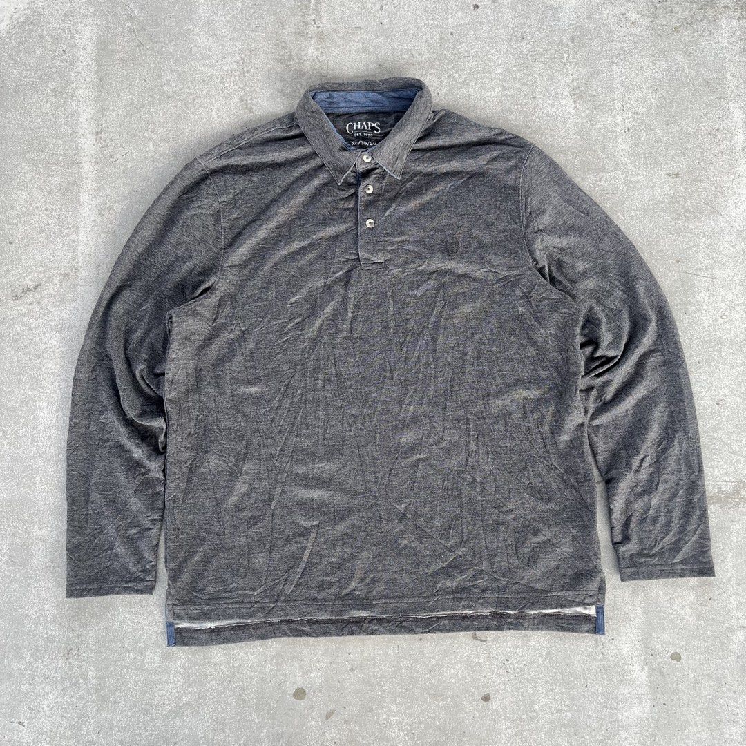 Chaps Grey Long Sleeve Polo Shirt (Category: Tshirts & Polo Shirts ) located in General Mariano Alvarez. Submitted by aaronatas819577 (Listing ID 1466161619, Image 1). Description: - Brand: Chaps - Size: XL - Color: Grey with blue inner collar trim - Material: Soft heathered fabric - Details: Classic collar, 3-button placket, and subtle embroidered chest logo - Condition: Great basic piece for layering or casual wear.