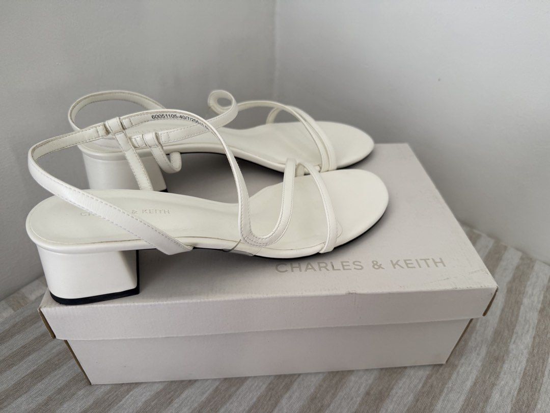 Charles & Keith Arden Chalk Sandals Size 40 (Category: Heels) located in Manila. Submitted by mollichie (Listing ID 1466217970, Image 2). Description: Charles & Keith Arden sandals in chalk white. Open toe design with multiple thin straps and a back strap. Chunky low block heel. Size 40. Original shoe box included. Only used once on my Civil Wedding..