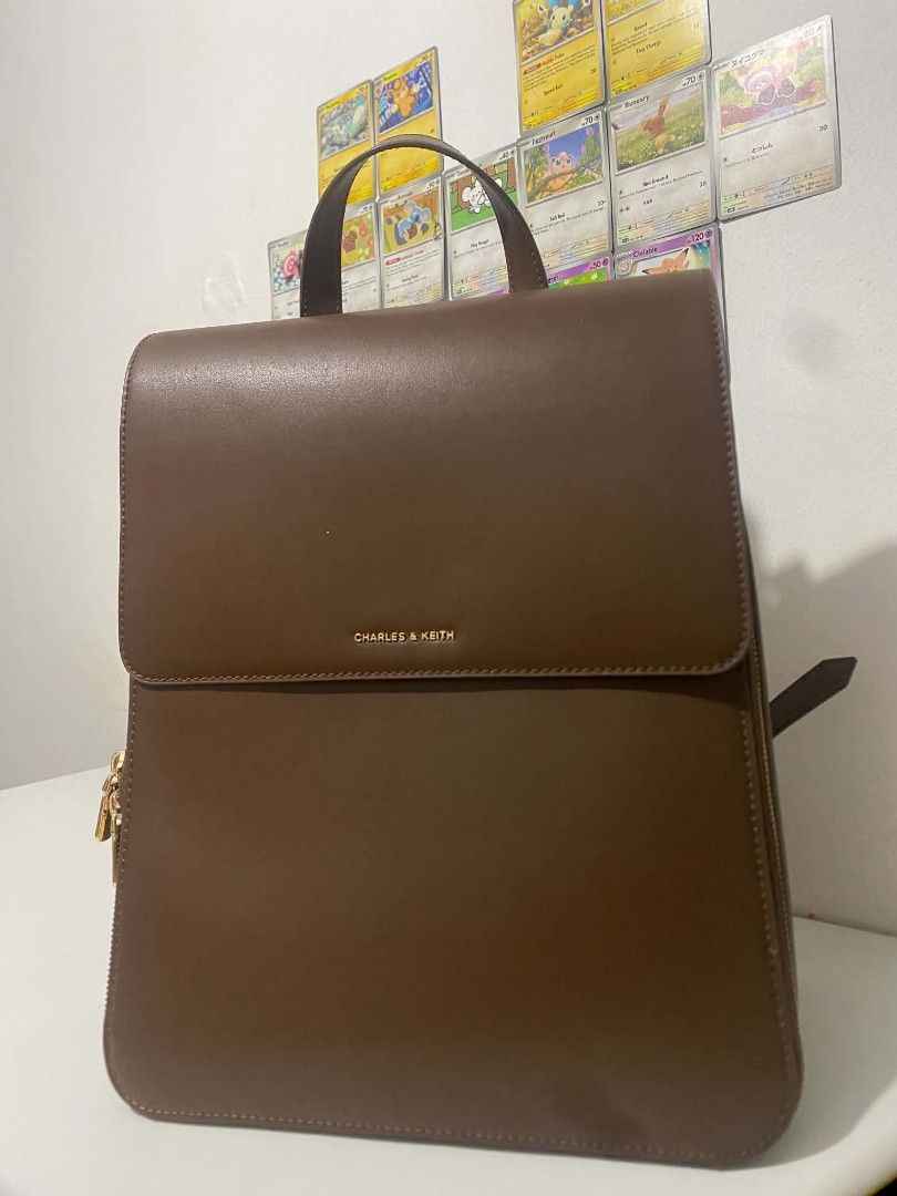 Charles & Keith Octavia Backpack (Category: Backpacks) located in Manila. Submitted by royalwater-108816 (Listing ID 1466157200, Image 1). Description: FOR SALE ‼️ CHARLES AND KEITH OCTAVIA BACKPACK (1 Backpack + 2 Detachable straps + Dust Bag) - used rarely (bought last april 2026 only) - Selling Price P4,500 (Bought it 5,000) slightly negotiable -RSF: Rarely used and need funds MEET UP: Any Lrt 1 Station.