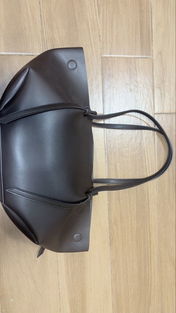 Charles and keith calla tote bag in brown (Category: Shoulder Bags) located in Manila. Submitted by serraphimav (Listing ID 1466161069, Image 2). Description: Bought this year (august), like new no issues on the bag its self, some makeup (foundation) on the pouch which is the only problem. Other than that there are NO problems with the bag only the pouch..