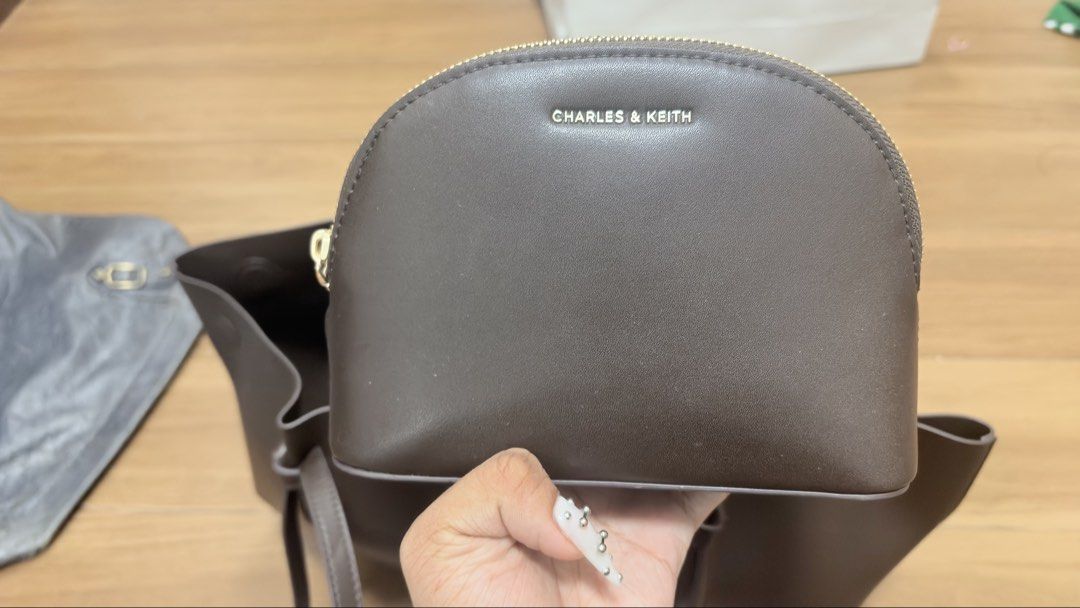 Charles and keith calla tote bag in brown (Category: Shoulder Bags) located in Manila. Submitted by serraphimav (Listing ID 1466161069, Image 3). Description: Bought this year (august), like new no issues on the bag its self, some makeup (foundation) on the pouch which is the only problem. Other than that there are NO problems with the bag only the pouch..