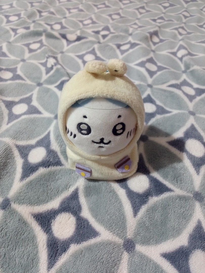 Chiikawa Snail Costume Plush Keychain (Category: Plushies & Soft Toys) located in Cateel. Submitted by neoo_c (Listing ID 1466244756, Image 1). Description: - Authentic Chiikawa plush mascot - Adorable design: Dressed in a cream snail hoodie with a purple shell - Features a cute embroidered face, whiskers, and rosy cheeks - Equipped with a blue ball chain for easy hanging on bags or keys - Fluffy, clean, and well-maintained fabric - Perfect for C