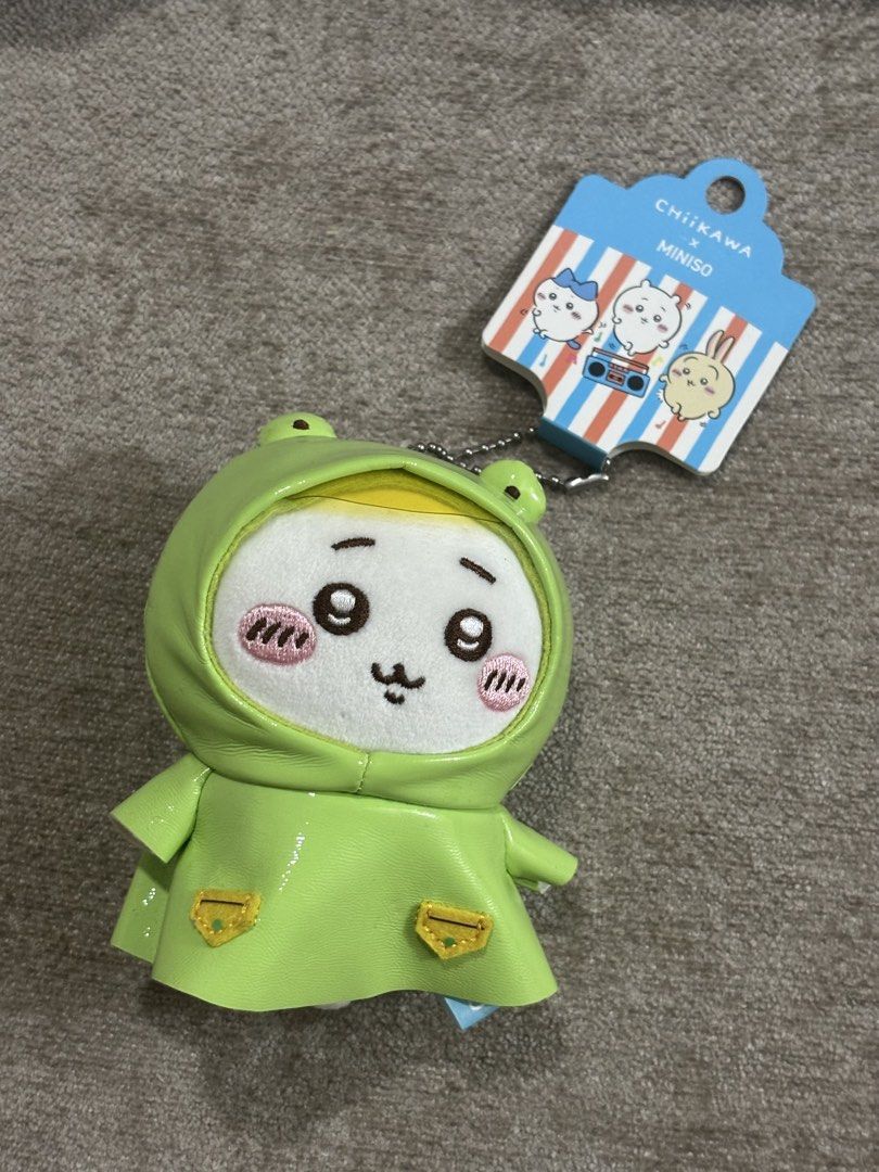 Chiikawa x Miniso Frog Raincoat Plush Keychain (Category: Plushies & Soft Toys) located in Binan City. Submitted by szummie (Listing ID 1466157589, Image 1). Description: - Authentic Chiikawa plush keychain from the Miniso collaboration - Comes with original cardboard tag still attached - Equipped with a ball chain for easy hanging on bags or keys.