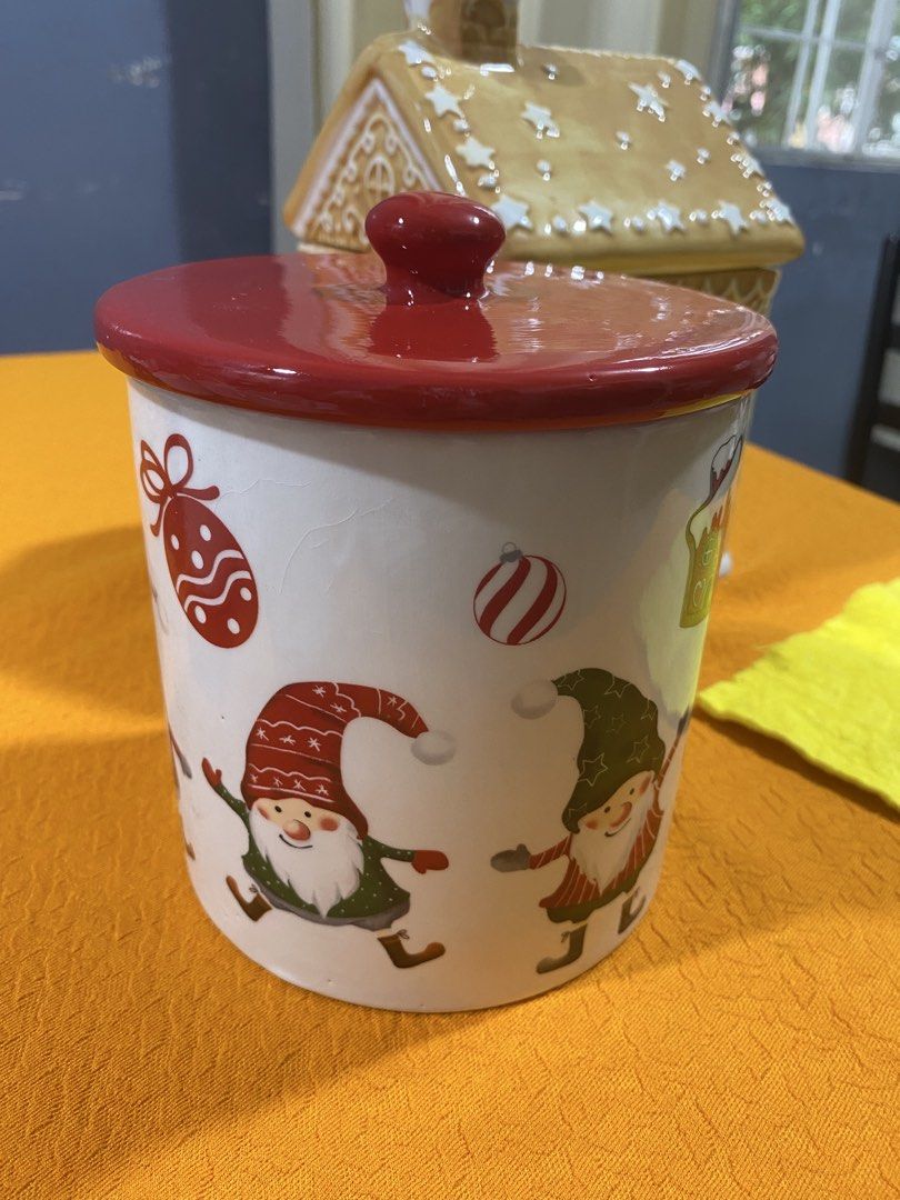 Christmas Gnome Ceramic Canister with Red Lid (Category: Vases & Decorative Bowls) located in Cavite. Submitted by tatashop_sky (Listing ID 1466323855, Image 1). Description: - Adorable Christmas gnome and holiday pattern design - Glossy red lid - Keeps cookies, tea bags, and treats fresh - Clean inside and out, ready for the holidays.