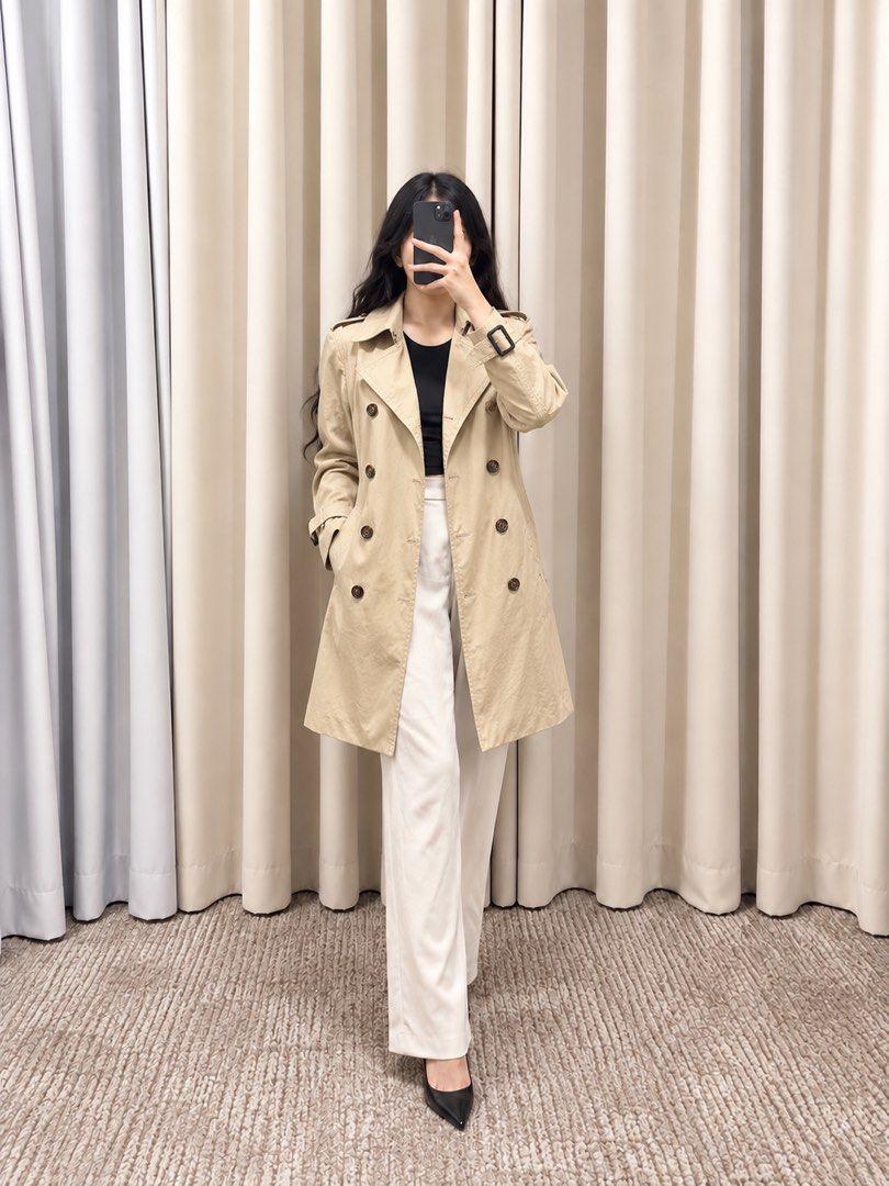 Classic Trench Coat in Deep Beige (Category: Coats, Jackets and Outerwear) located in Taguig. Submitted by vm.co (Listing ID 1466320823, Image 1). Description: Classic Trench Coat 🤎 Knee-length • Double-breasted • Leather buckle wrist detail Structured trench coat fabric with a classic, polished finish..