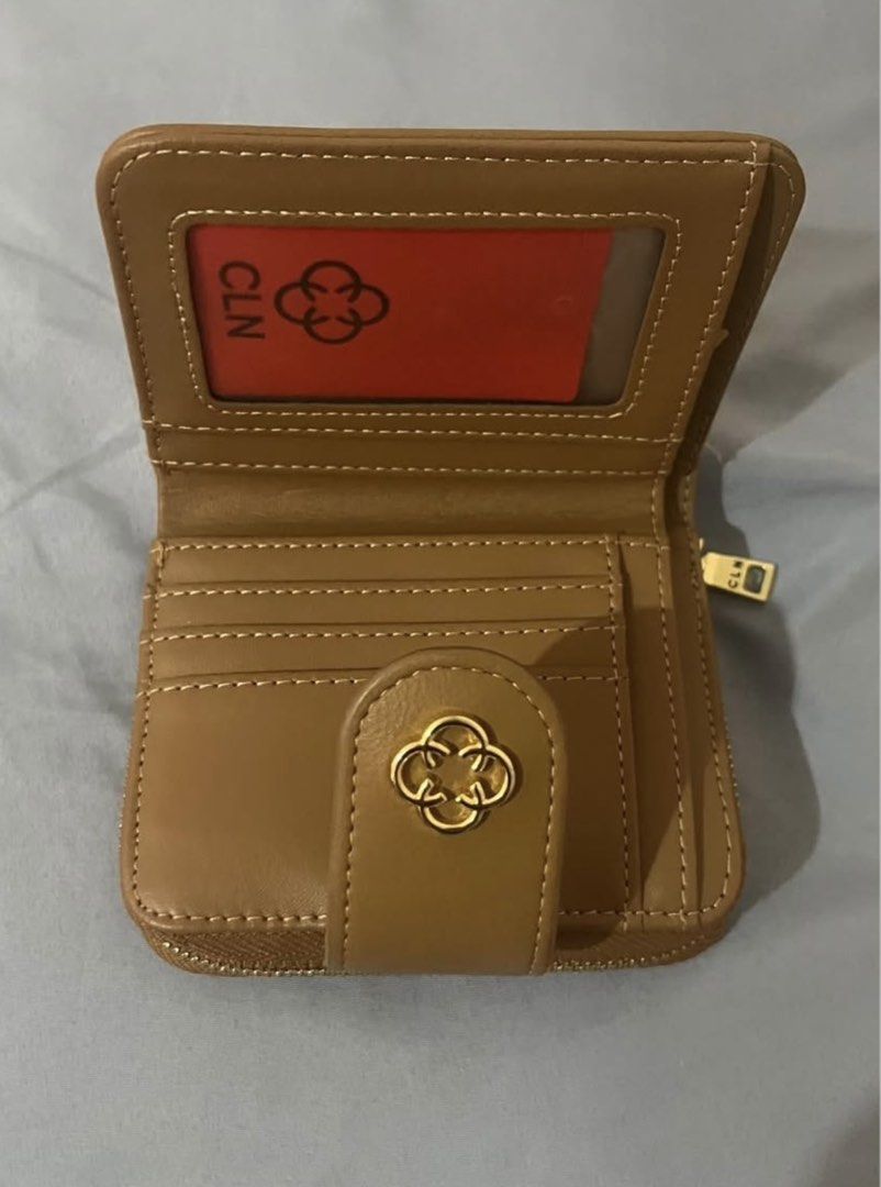 CLN Kathie Wallet Beige Woven (Category: Wallets & Card holders) located in Bacolod City. Submitted by k8tk4t_ (Listing ID 1466317249, Image 3). Description: - Brand: CLN (Kathie design) - Color/Pattern: Chic beige woven pattern - Features: Multiple card slots, ID window, and secure zip coin pocket - Hardware: Elegant gold-tone with clasp closure - Condition: Brand new / Great quality - Original Retail Price: ₱799 -Selling for:₱650 only BCD.