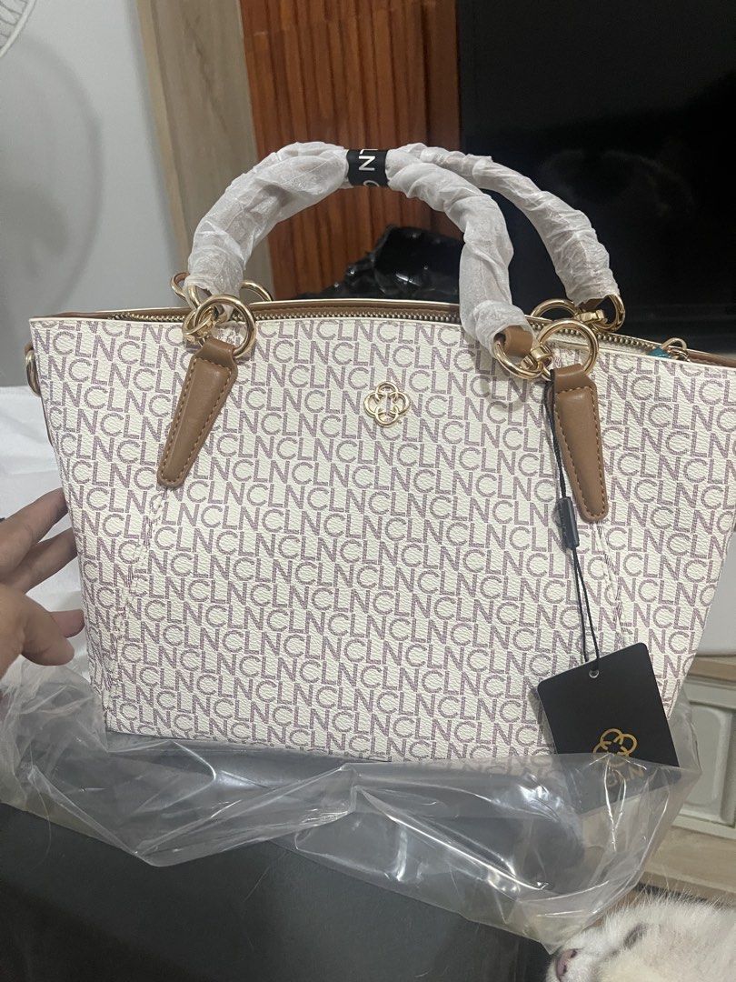 CLN Vienne Handbag Van Tan-X Monogram Tote (Category: Luxury Bags & Wallets) located in Manila. Submitted by jvlni (Listing ID 1466334058, Image 2). Description: - Brand: CLN - Model: Vienne Handbag - Colorway: Van Tan-X - Design: All-over monogram print with brown handles and gold-tone hardware - Closure: Zipper top closure - Condition: Brand new, handle wrappings still intact - Inclusions: Original dust bag, attached tag, and purchase receipt d