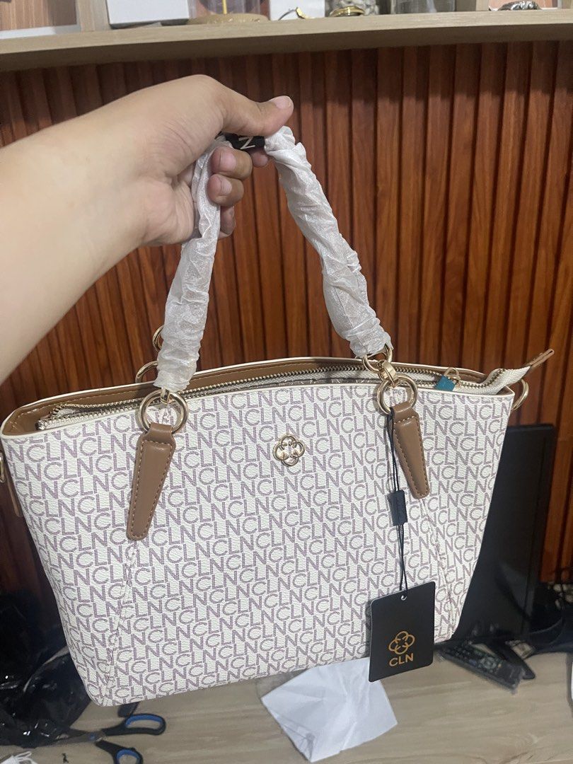 CLN Vienne Handbag Van Tan-X Monogram Tote (Category: Luxury Bags & Wallets) located in Manila. Submitted by jvlni (Listing ID 1466334058, Image 1). Description: - Brand: CLN - Model: Vienne Handbag - Colorway: Van Tan-X - Design: All-over monogram print with brown handles and gold-tone hardware - Closure: Zipper top closure - Condition: Brand new, handle wrappings still intact - Inclusions: Original dust bag, attached tag, and purchase receipt d