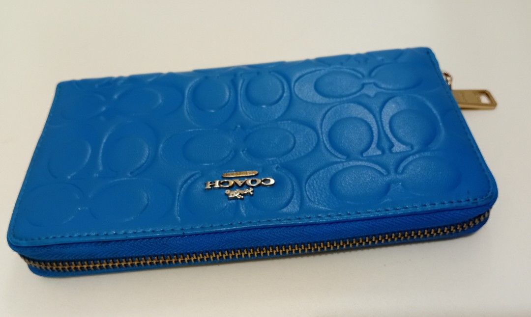 COACH ACCORDION LONG ZIP WALLET (Category: Luxury Bags & Wallets) located in Manila. Submitted by eriiicaspage (Listing ID 1466157716, Image 3). Description: PREOWNED LIKENEW Coach wallet featuring the iconic debossed signature C pattern - Elegant gold-tone hardware with metal logo accent on the front - Secure zip-around closure to keep your essentials safe - Well-organized interior with multiple card slots, slip compartments, and a zippered coin