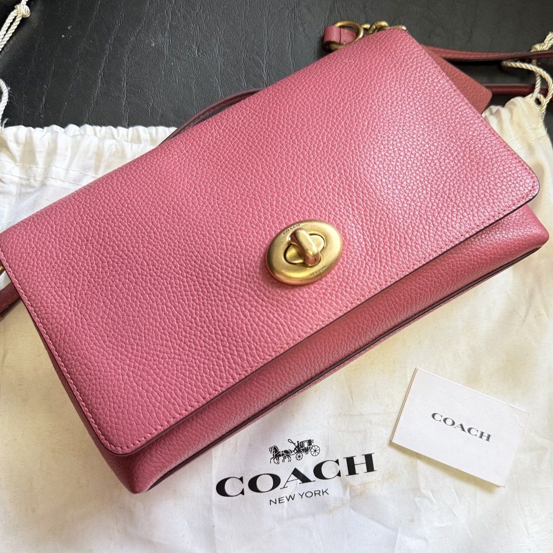 Coach Crosstown Crossbody Bag (Category: Luxury Bags & Wallets) located in Manila. Submitted by she_alice (Listing ID 1466327638, Image 2). Description: - Authentic Coach leather handbag in a gorgeous pink pebble grain - Elegant gold-tone hardware and secure front flap turnlock closure - Stylish chain and leather shoulder strap for comfortable wear - Features the iconic Coach creed patch - Includes original dust bag and care card - Can pass as br