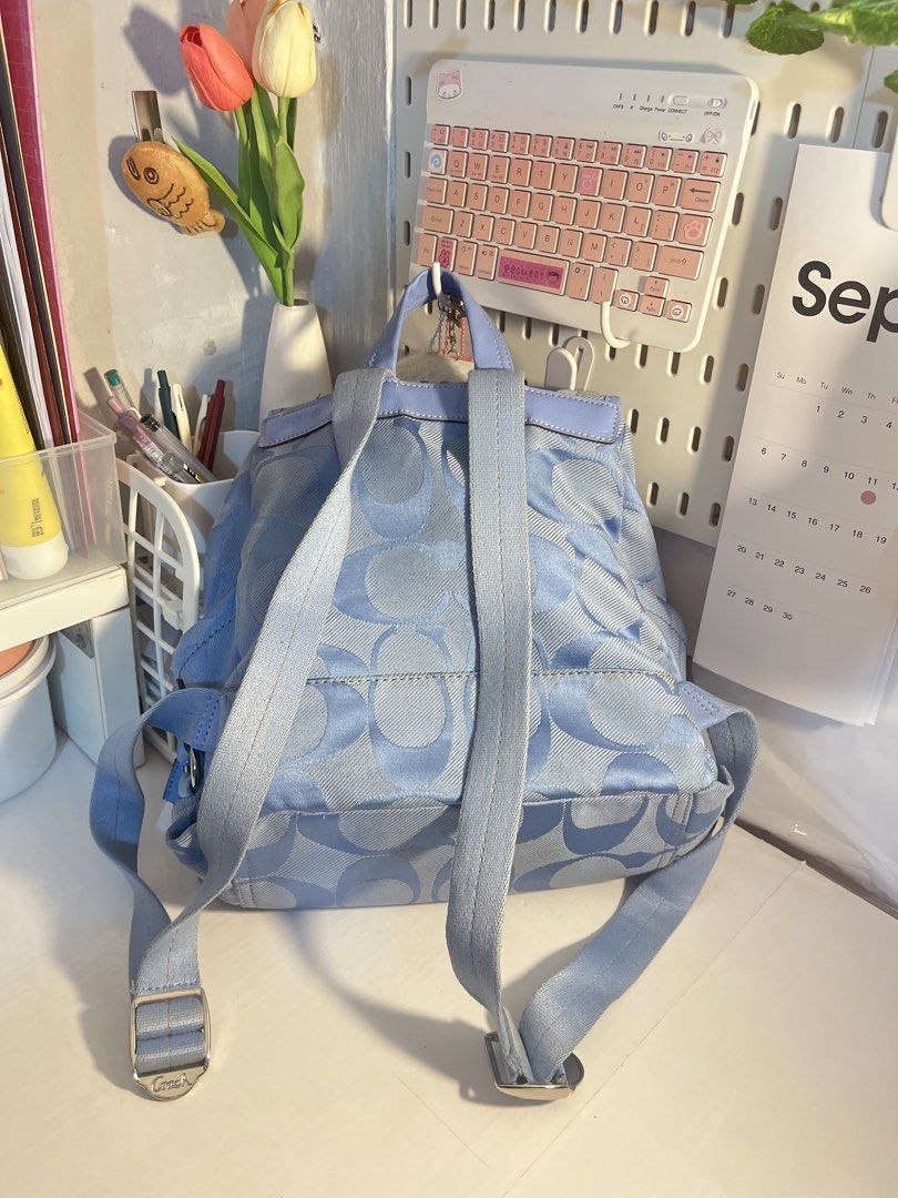 Coach Kyra Daisy Signature Backpack (Category: Backpacks) located in Muntinlupa City. Submitted by pique.unique (Listing ID 1466293267, Image 2). Description: Coach Kyra Daisy Signature Backpack in a light blue or periwinkle colorway - Authenticity Guaranteed - Rank AB - Medium BackPack - Rare Piece Very Classy Colorway Condition See Photos for details Asking Price: 5,500 Dm me If Interested 📩 Location: Muntinlupa City .