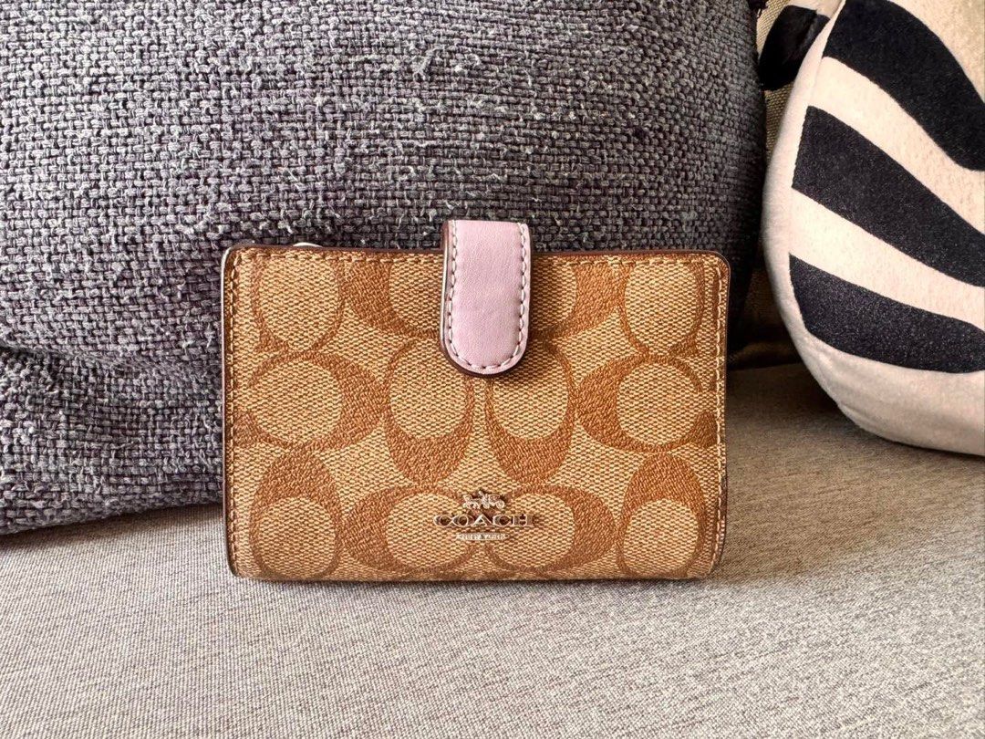 Coach Medium Corner Zip Wallet F23553 (Category: Wallets & Card holders) located in Manila. Submitted by flojo1220 (Listing ID 1466216499, Image 1). Description: - Brand new with original store tag and internal protectors - Authentic Coach Wallet F23553 - Signature khaki PVC with stylish lilac leather trim - Secure snap closure for main compartment - Multiple card slots, ID window, and full-length bill compartment - Handy zip coin pocket on the s