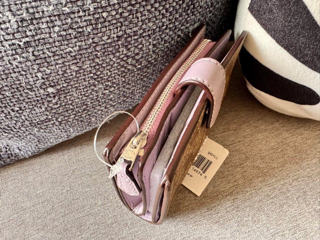 Coach Medium Corner Zip Wallet F23553 (Category: Wallets & Card holders) located in Manila. Submitted by flojo1220 (Listing ID 1466216499, Image 3). Description: - Brand new with original store tag and internal protectors - Authentic Coach Wallet F23553 - Signature khaki PVC with stylish lilac leather trim - Secure snap closure for main compartment - Multiple card slots, ID window, and full-length bill compartment - Handy zip coin pocket on the s
