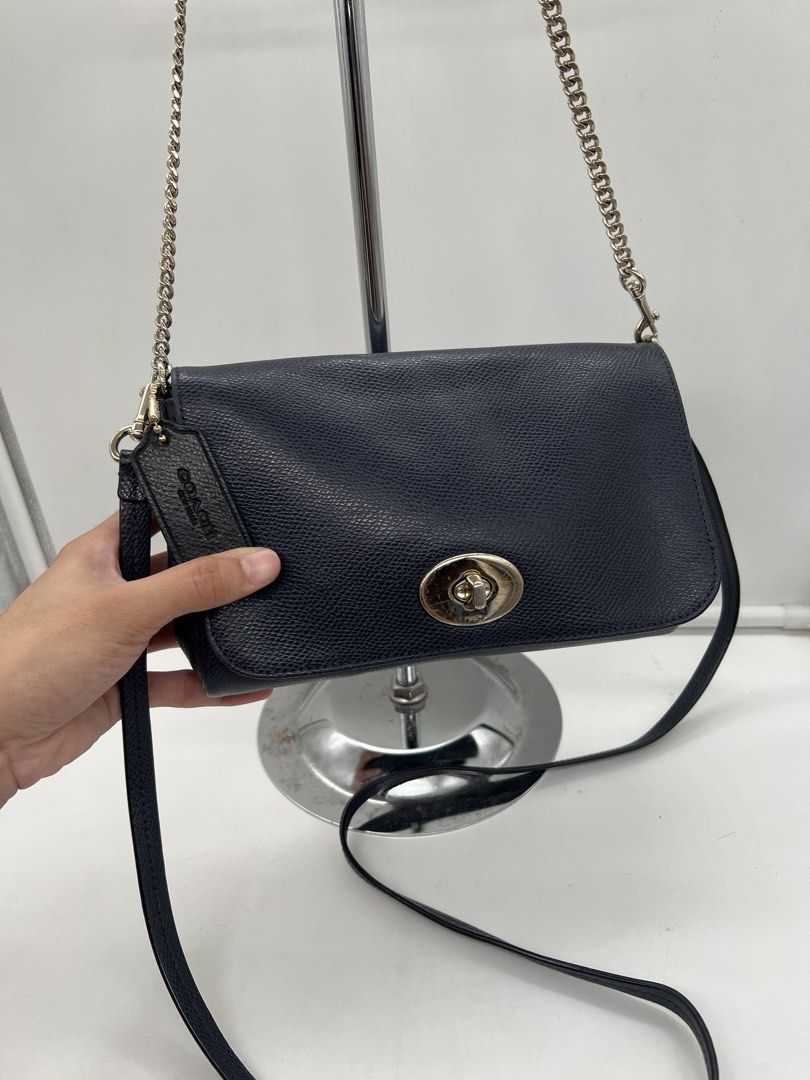 Coach Mini Ruby navy blue pebbled leather 2way shoulder chain Crossbody Bag (Category: Shoulder Bags) located in Cavite. Submitted by aellavier (Listing ID 1466171928, Image 2). Description: orig preloved auth. minor issue: black hangtag (not navy blue), needs minimal cleaning. may signs of use sa lining ng bag.