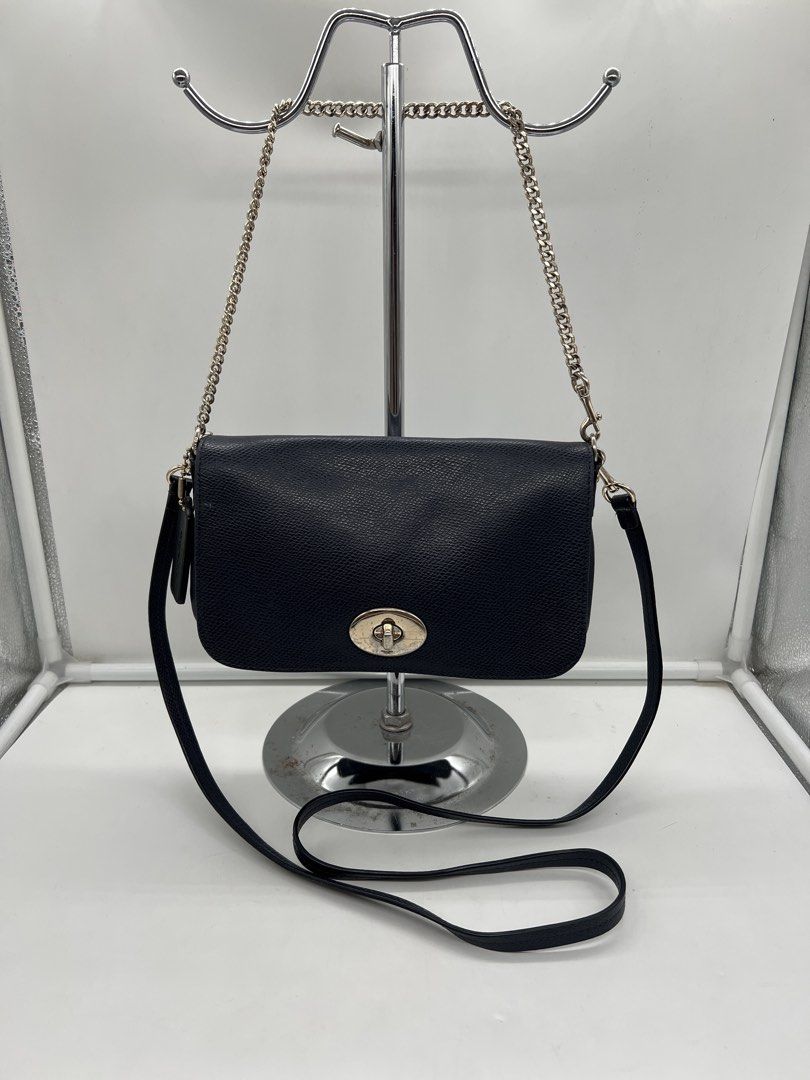 Coach Mini Ruby navy blue pebbled leather 2way shoulder chain Crossbody Bag (Category: Shoulder Bags) located in Cavite. Submitted by aellavier (Listing ID 1466171928, Image 1). Description: orig preloved auth. minor issue: black hangtag (not navy blue), needs minimal cleaning. may signs of use sa lining ng bag.